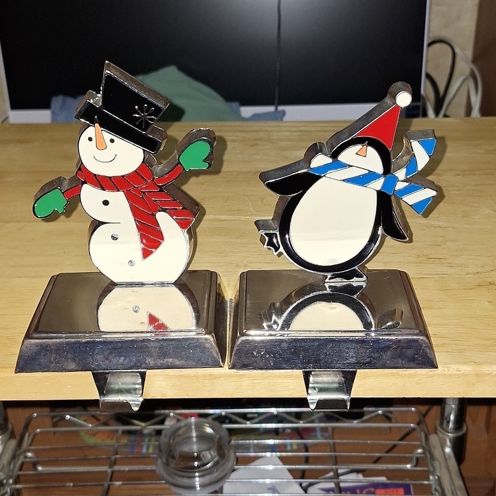 An unbranded Penguin Stocking Holder    It's base is 4"x3" and stands 5" tall.